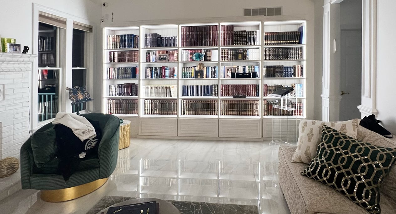 Custom Library Bookshelves | California Closets Southern New Jersey Library bookshelves with custom shelves and cabinets and LED lighting throughout by California Closets Southern New Jersey