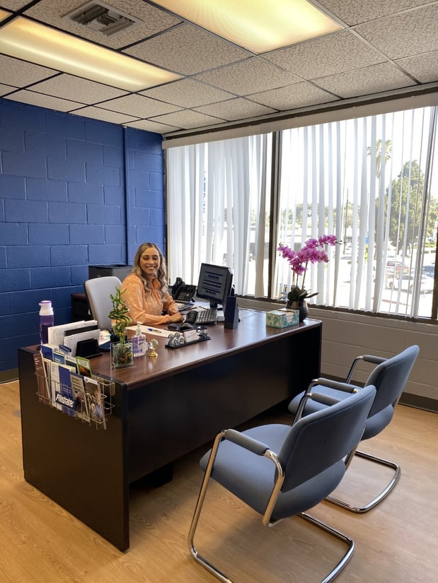 The agent Veronica Sanchez in her office delighted to ensure you and your family's insurance needs are met.