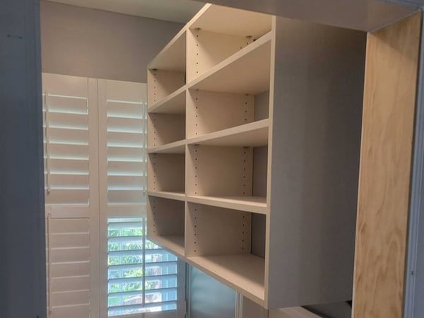 Modern wooden shelving for any space you need by California Closets Wilmington, North Carolina.