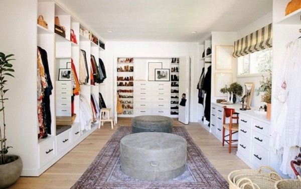 Large Walk-In Closet Large white walk-in closet with shoe and clothing storage.