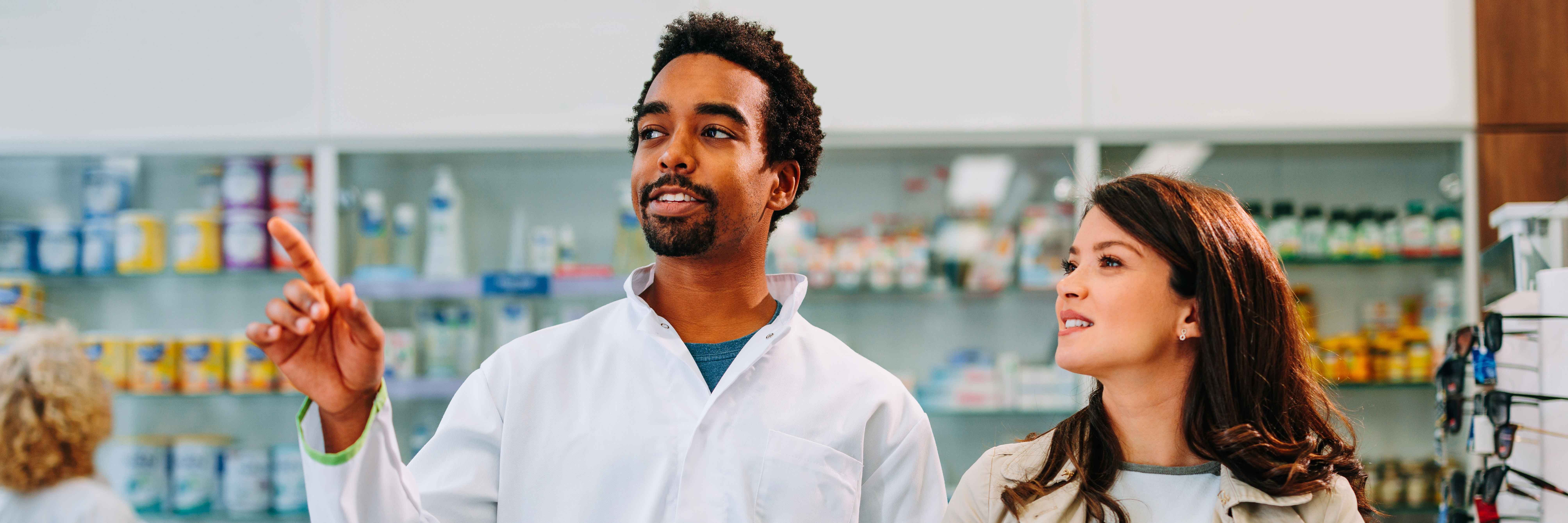 pharmacist helping a customer for an upcoming vacation