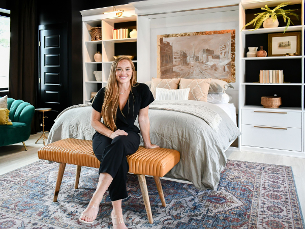 As Seen On HGTV's Good Bones Risky Business Good Bones's Mina sits in front of a California Closets Murphy Bed.