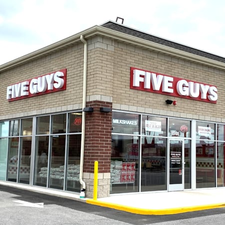 Exterior photograph of the Five Guys restaurant at 10708 Broadway Street in Crown Point, Indiana.