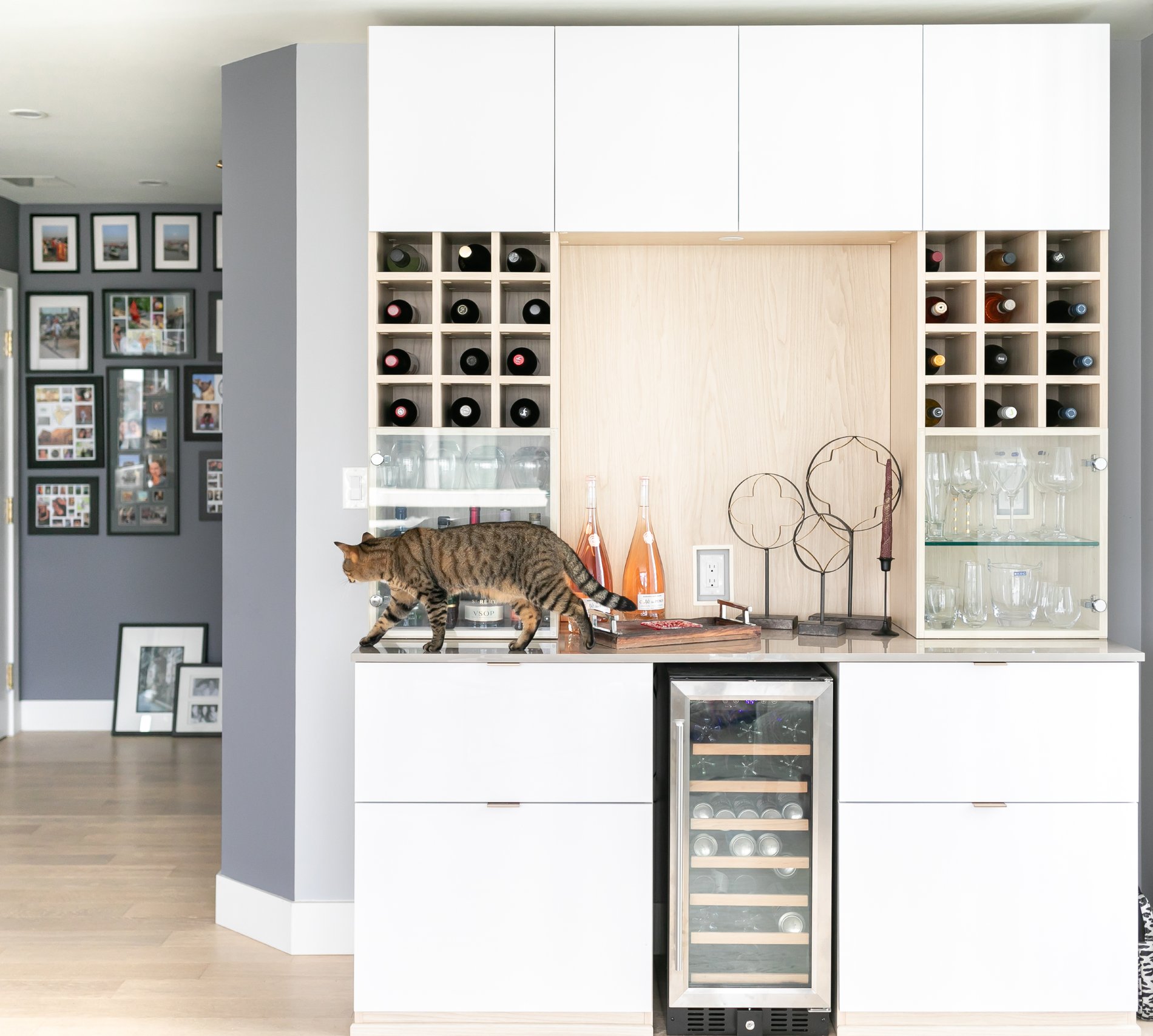 Custom Wine Bar with Storage custom wine bar with space for wine fridge and drawers for additional storage by California Closets Vancouver, British Columbia.