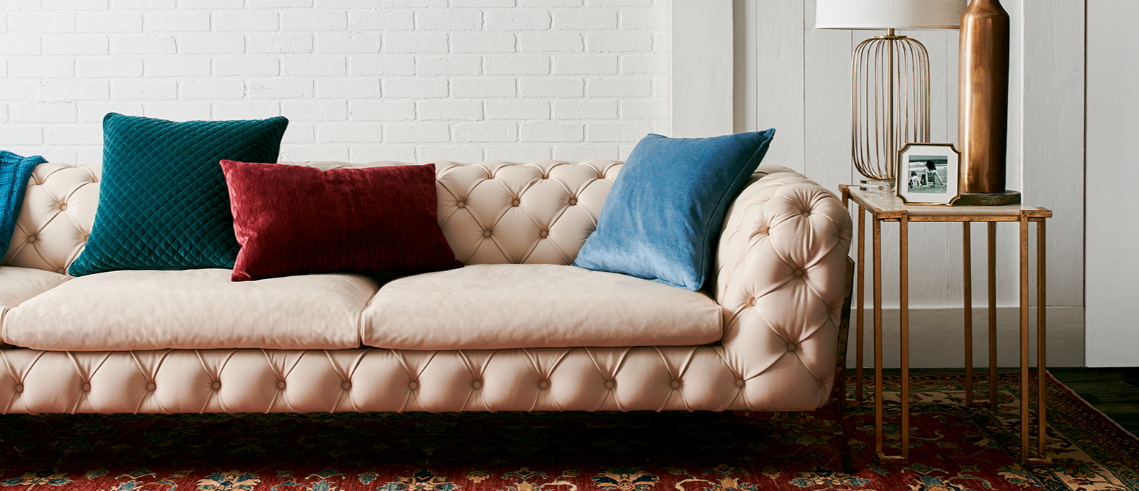 Cream leather tufted sofa