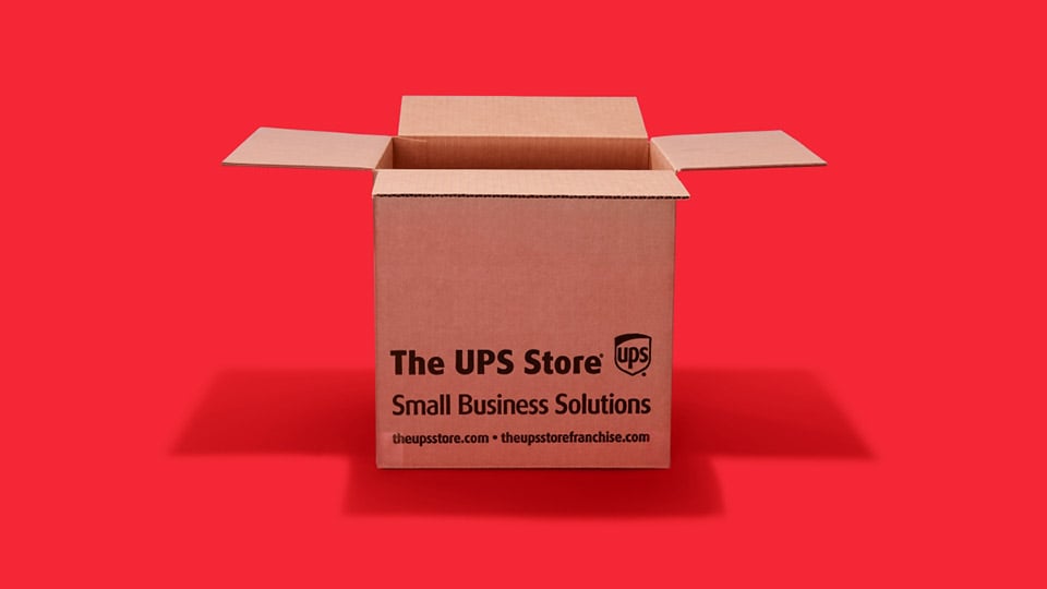 A sturdy shipping box with the text The UPS Store - Small Business Solutions - theupstore.com