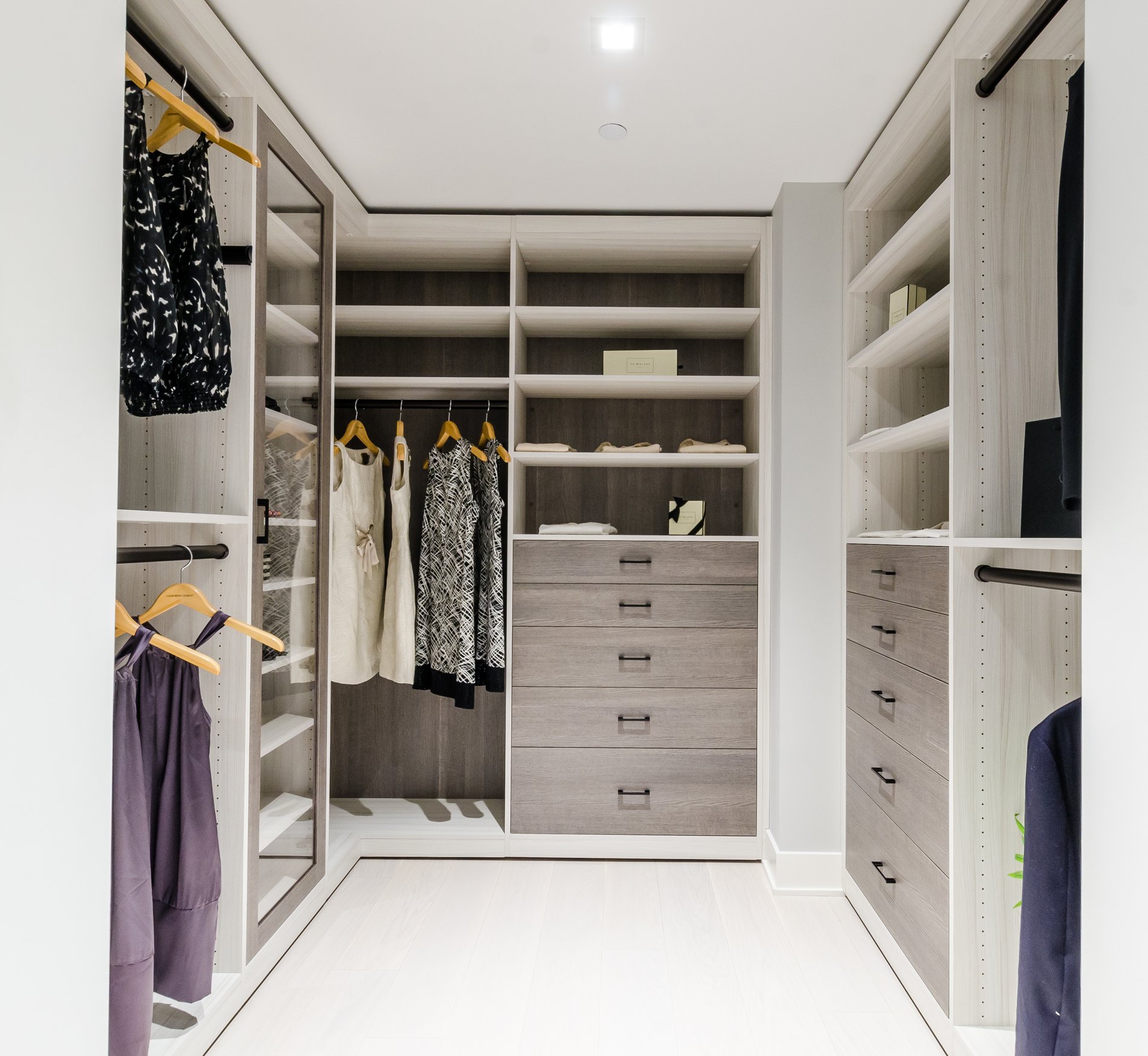 Classic Walk-in Closet Walk-in closet california closets new york westchester gray with chrome gray handles clear door closed storage hanging, shelves