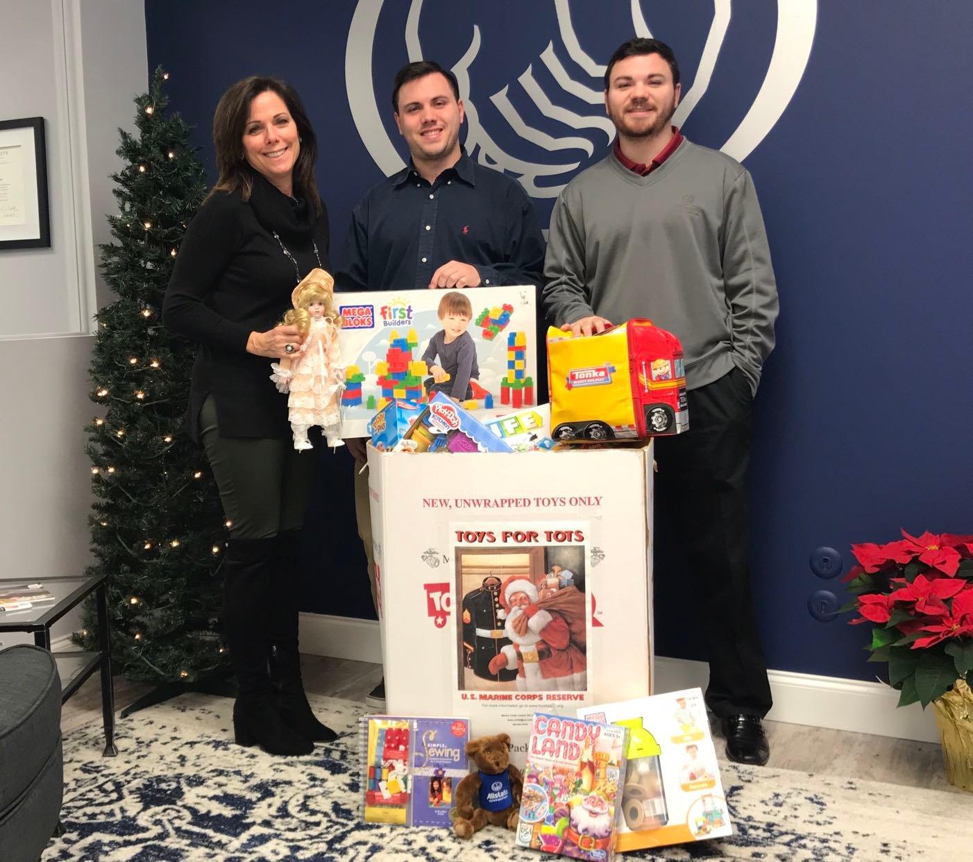 Bev Logan, EA; Thomas Logan, LSP; Jonathan Logan, LSP with Toys for Tots box