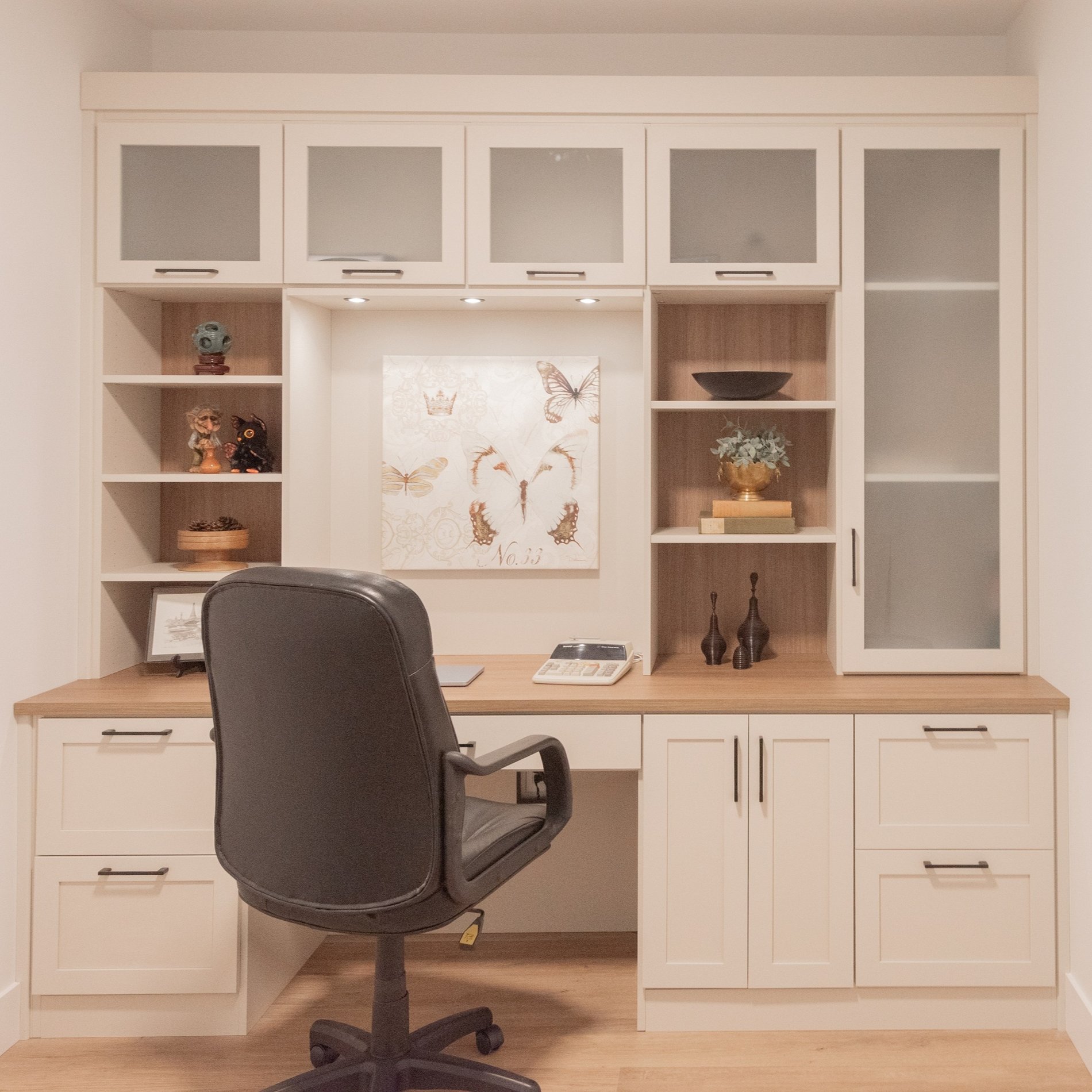Elevated Home Office Light and bright home office with contrasting countertop, backing and lighting.