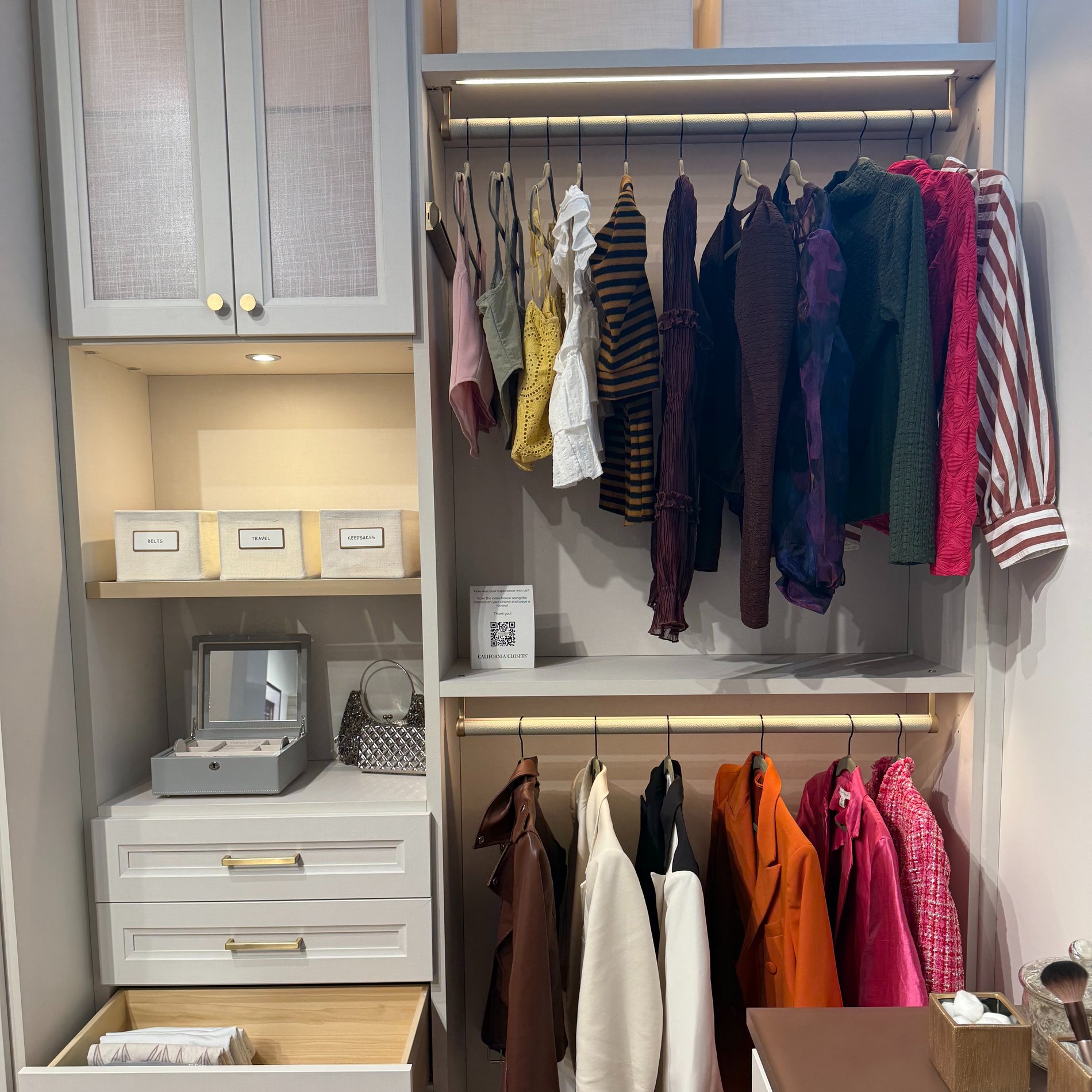 Walk In Closet Walk in closet with lighting and drawers for extra storage.