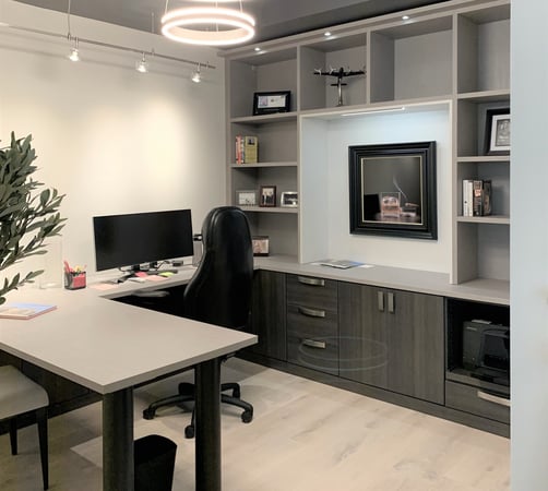 Custom home office in grey and dark wood by California Closets Sarasota, Florida.