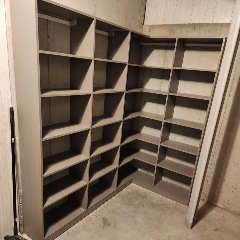 Stylish Corner Shelving in a Wood Finish A wood-finish corner shelving unit for stylish organization.