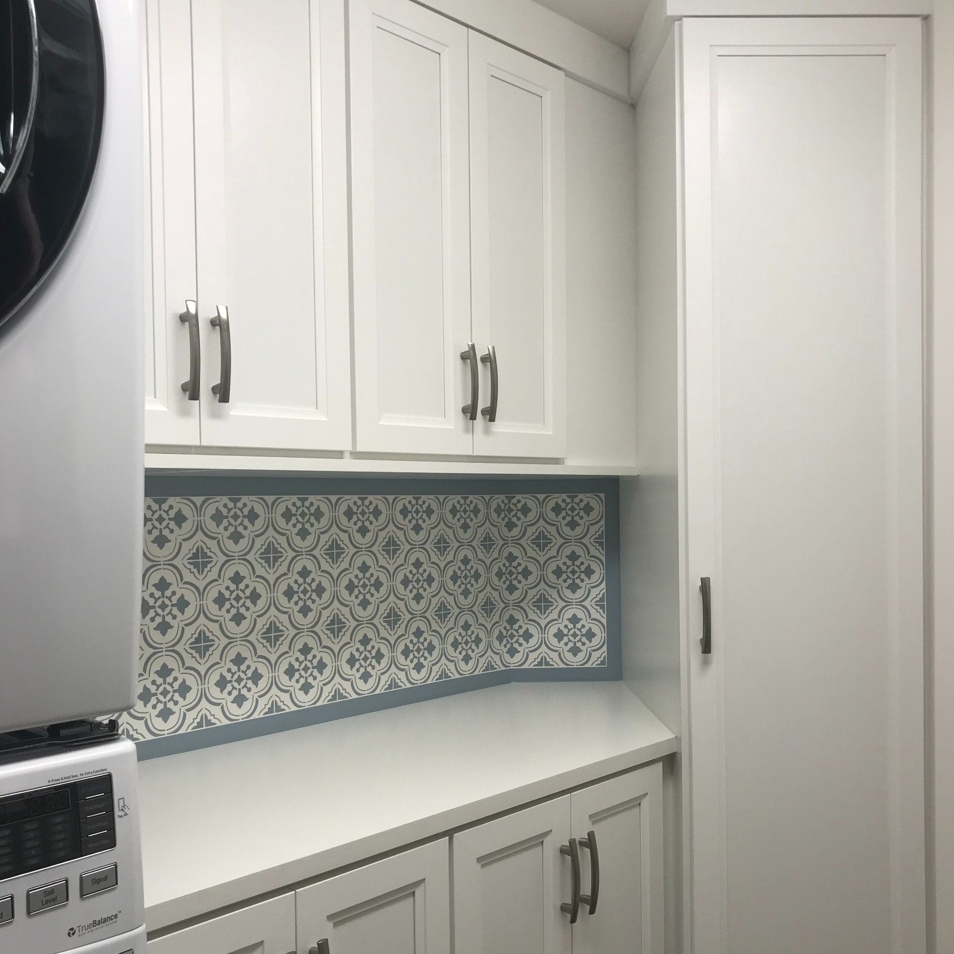 Elegant Laundry Room with Custom Lexington Frames in Dove LAUNDRY room on an ANGLED WALL with LEXINGTON FRAMEs in DOVE with CUSTOM HANDLES
