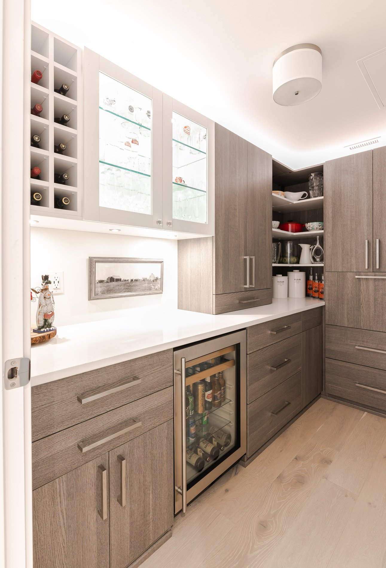 Modern pantry Modern pantry with neutral wood tones and a glass display cabinet