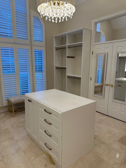 Walk In Closet Custom walk in closet with an island.