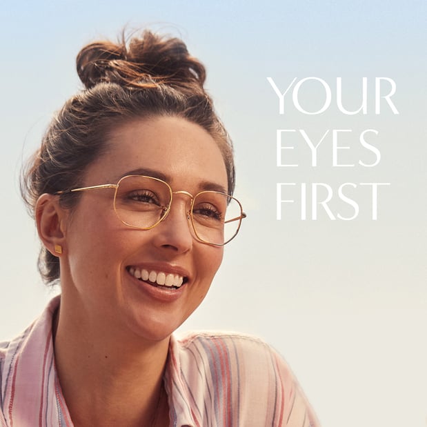 Woman smiling while wearing LensCrafters eyeglasses