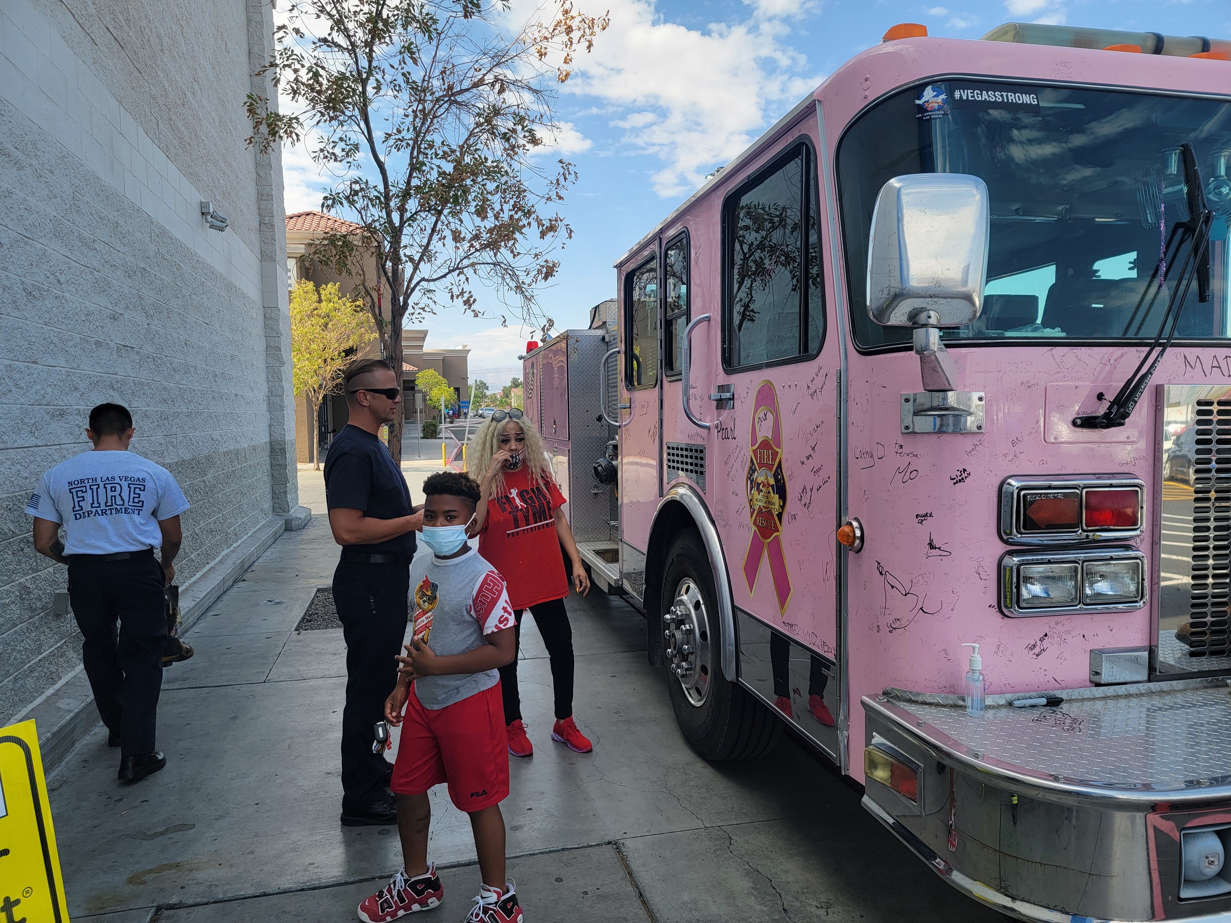 Customers admiring the Pink NLV Fire Truck