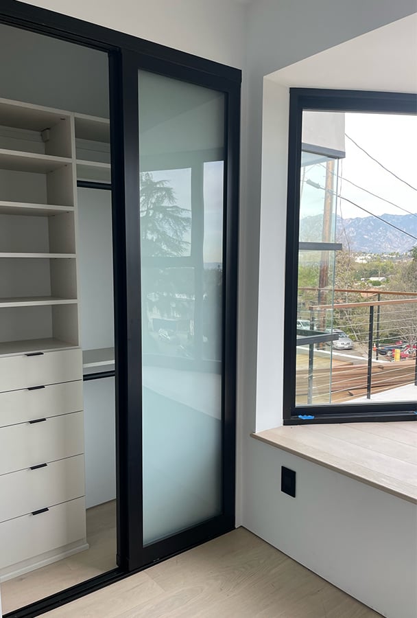 Reach In Closet Design | California Closets Pasadena Reach-in closet with shelves, drawers, hanging area by California Closets Pasadena.