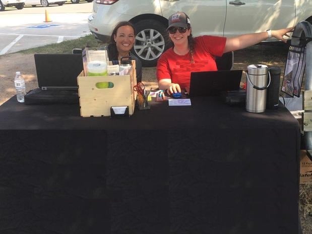 Natalie Martin helping our great sponsors check people in to get their rock chips in the windshields fixed during the customer appreciation event