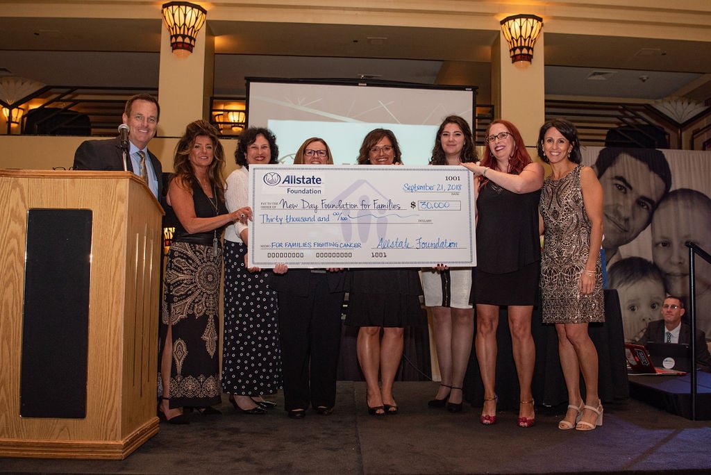 Presenting a $30,000 grant to New Day Foundation for Families