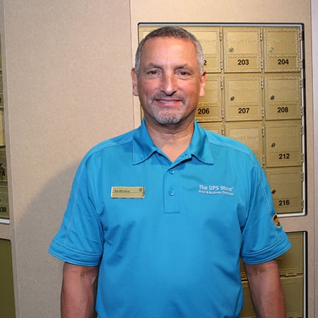 Owner in front of mailboxes