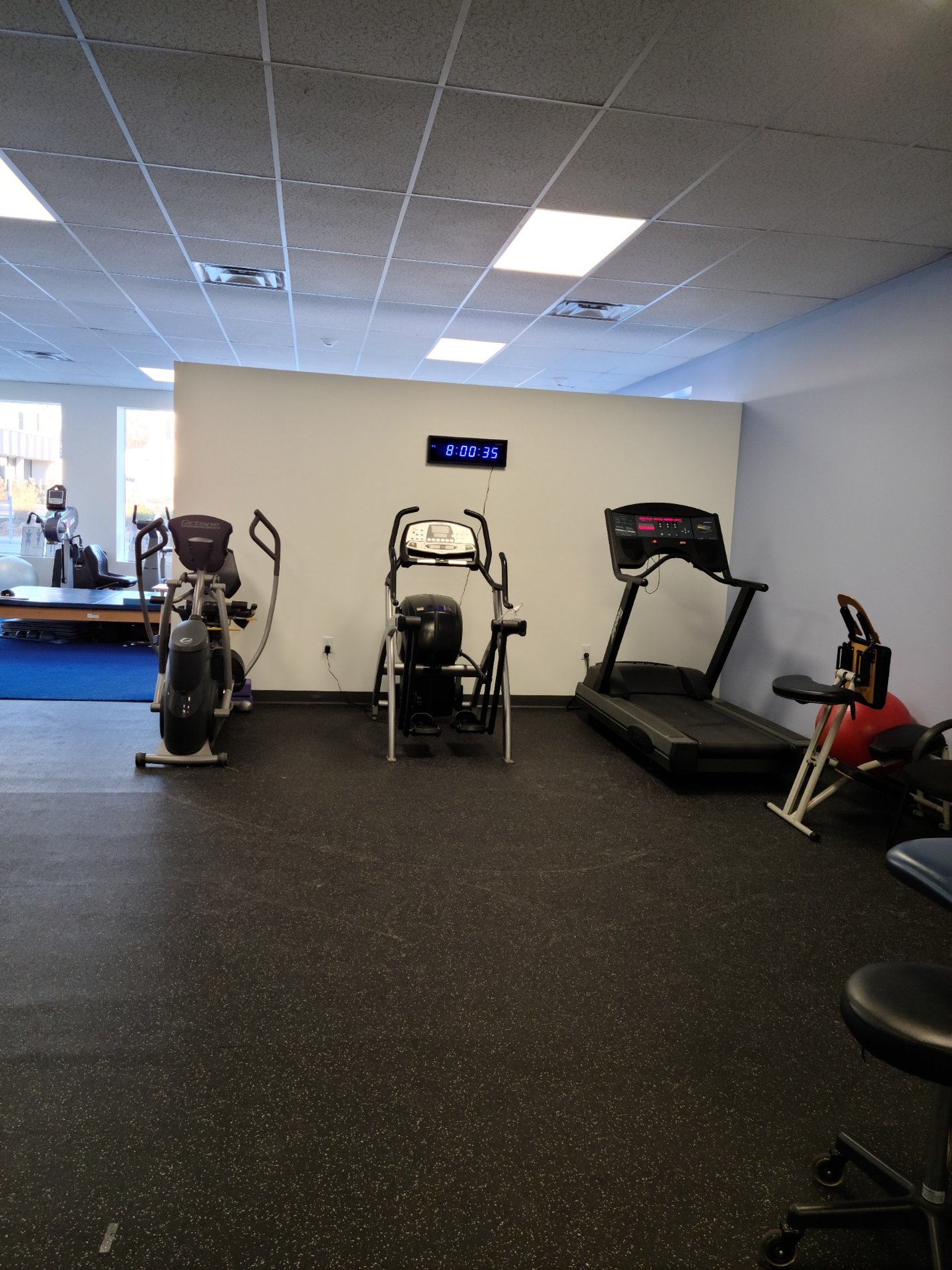 RI-Cranston-BSPT patient care area with PT equipment.