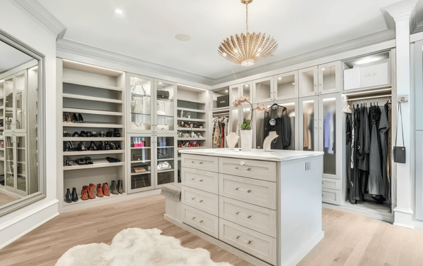 Luxe Dressing Room Large dressing room with center island, glass door inserts and lighting