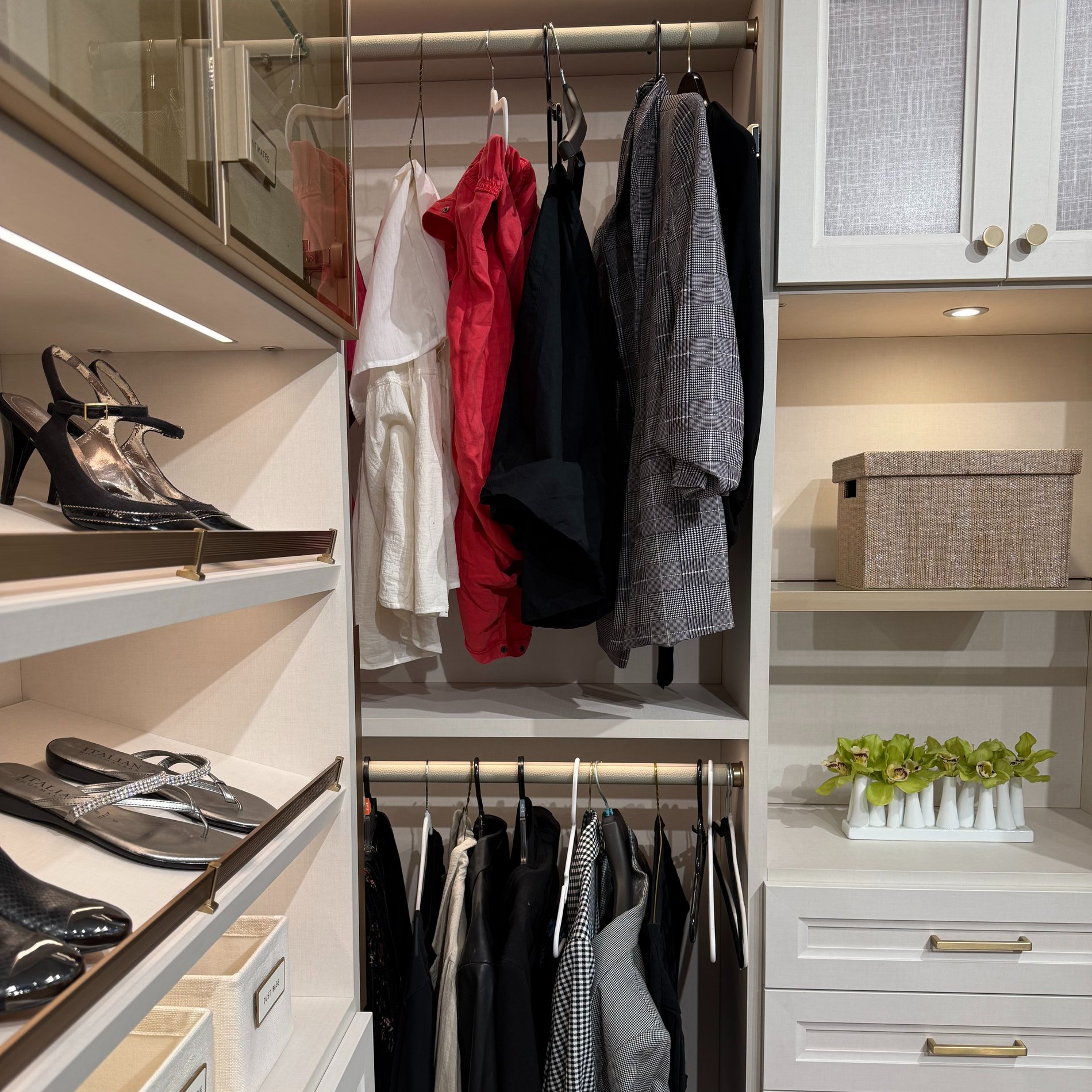 Walk In Closet Walk in closet with shoe storage and cabinets.