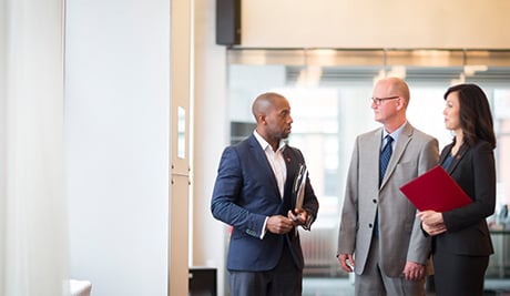 Co-workers discussing general liability insurance