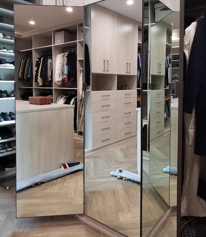 Mirrored walk-in closet with center island