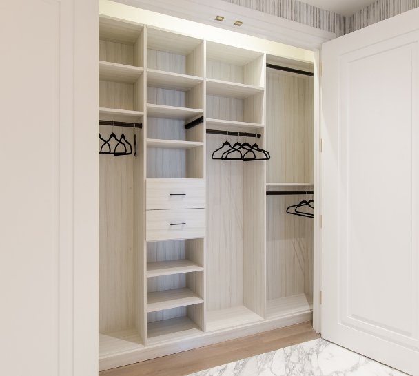 Sleek White Reach-in Closet California Closets New York NY White Reach-in Closet with Shelving, Hanging, and Black Hanging Rods