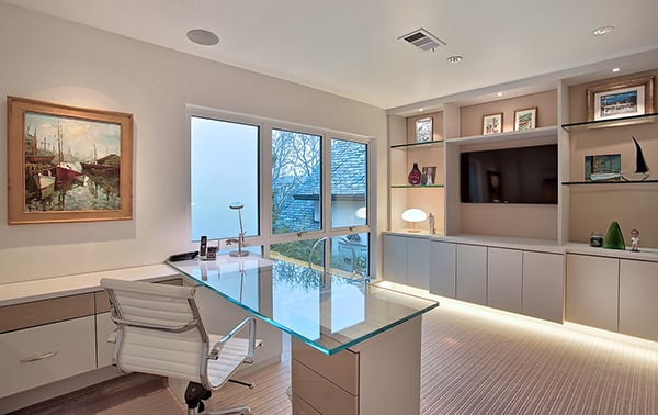 Custom Home Office Built Ins | California Closets Orange County Home office with custom built in drawers and glass shelving with LED lighting created by California Closets Orange County.