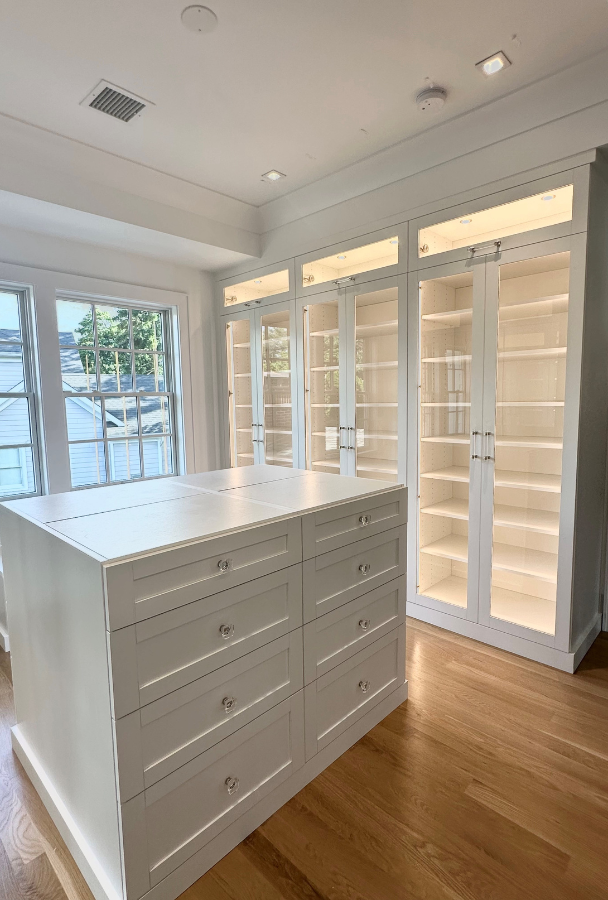 White Walk-in Closet with Center Island California Closets closet design nyc shoe storage luxury closets walk in closet designs closet designers built-in closets closet ideas walk in closet designs