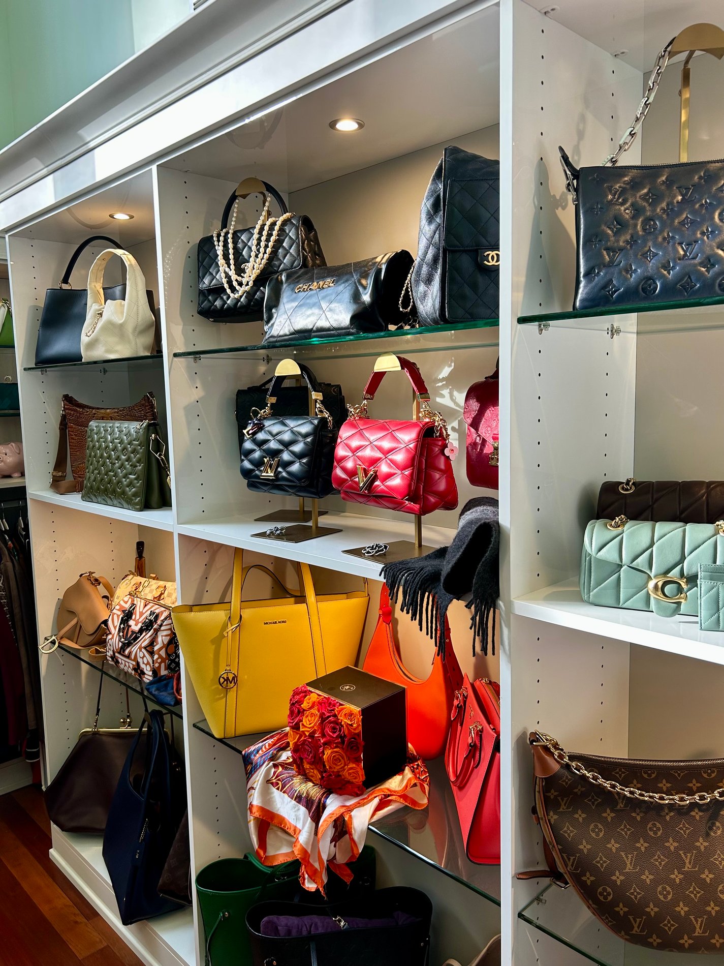 Custom Shelving Custom purse shelving with lighting and glass shelving.