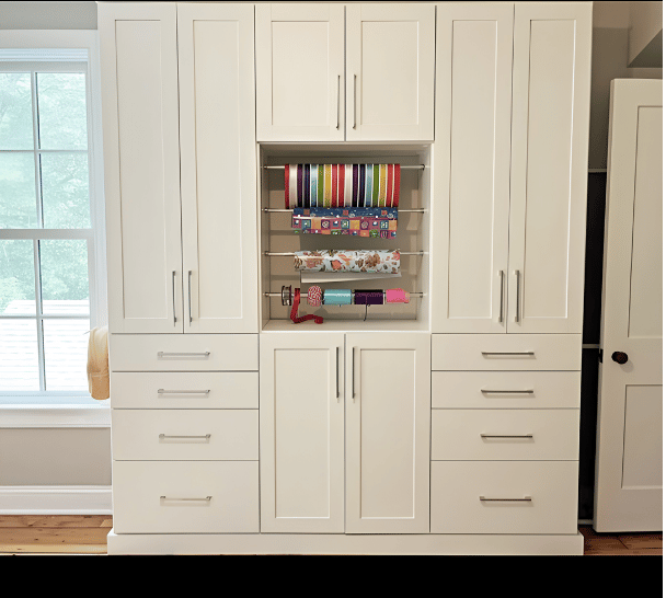 Craft Cabinet White craft cabinets and rods to hold ribbons and paper