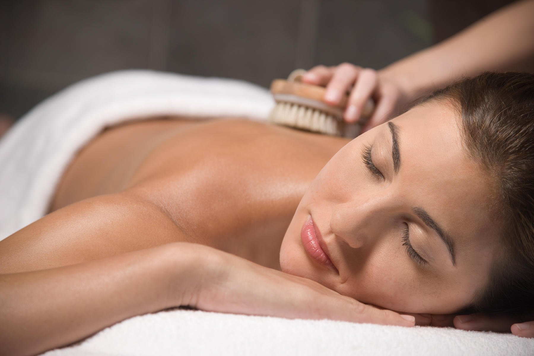 woman-getting-massage-with-dry-brush