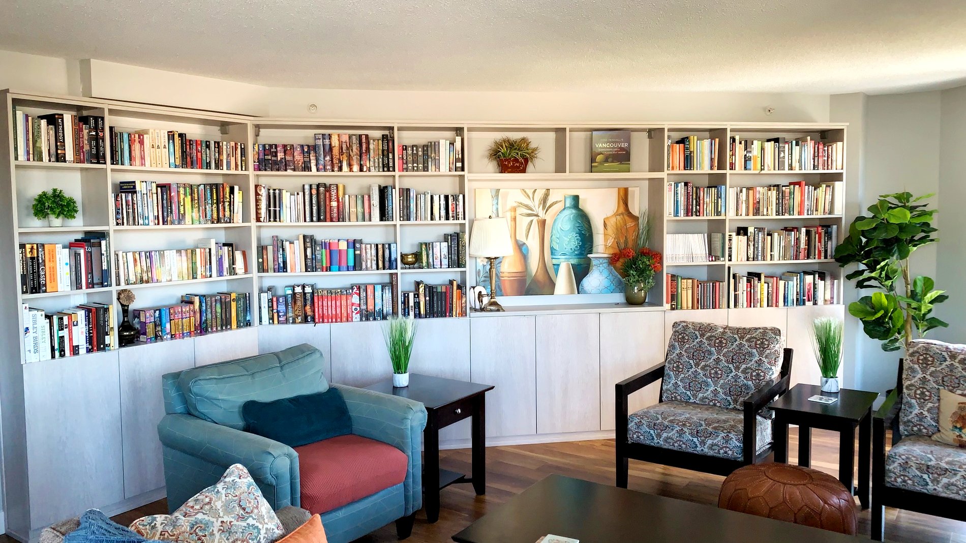 Custom shelves with lower cabinets Bookshelves and lower cabinets built at an angle to accommodate the room shape