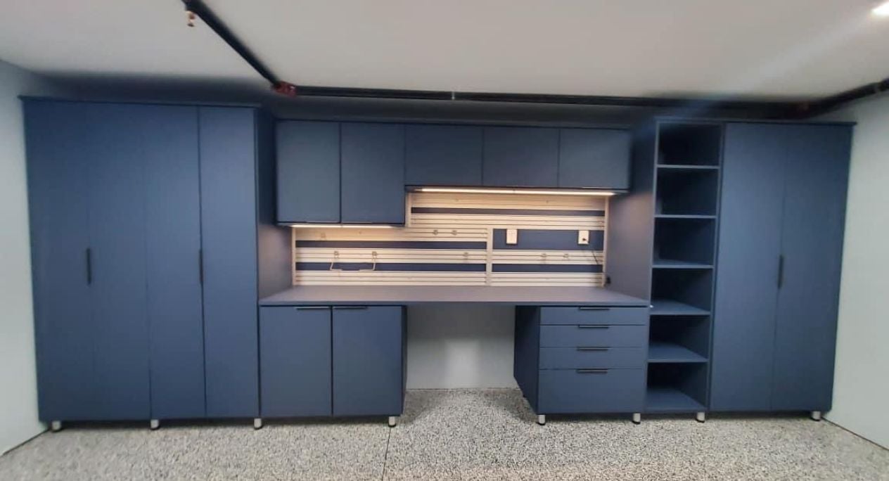 Deep Pond Garage System A sleek garage with storage by California Closets Charlotte, North Carolina.