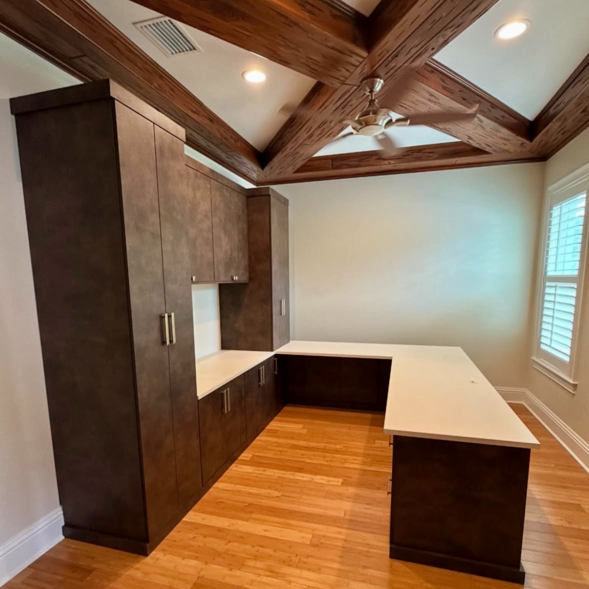 Home Office in Maya Bronze with Pyramid Hardware Custom home office in Maya Bronze storage with Pyramid handles in tumbled white bronze by Schaub, designed for a refined and functional workspace.