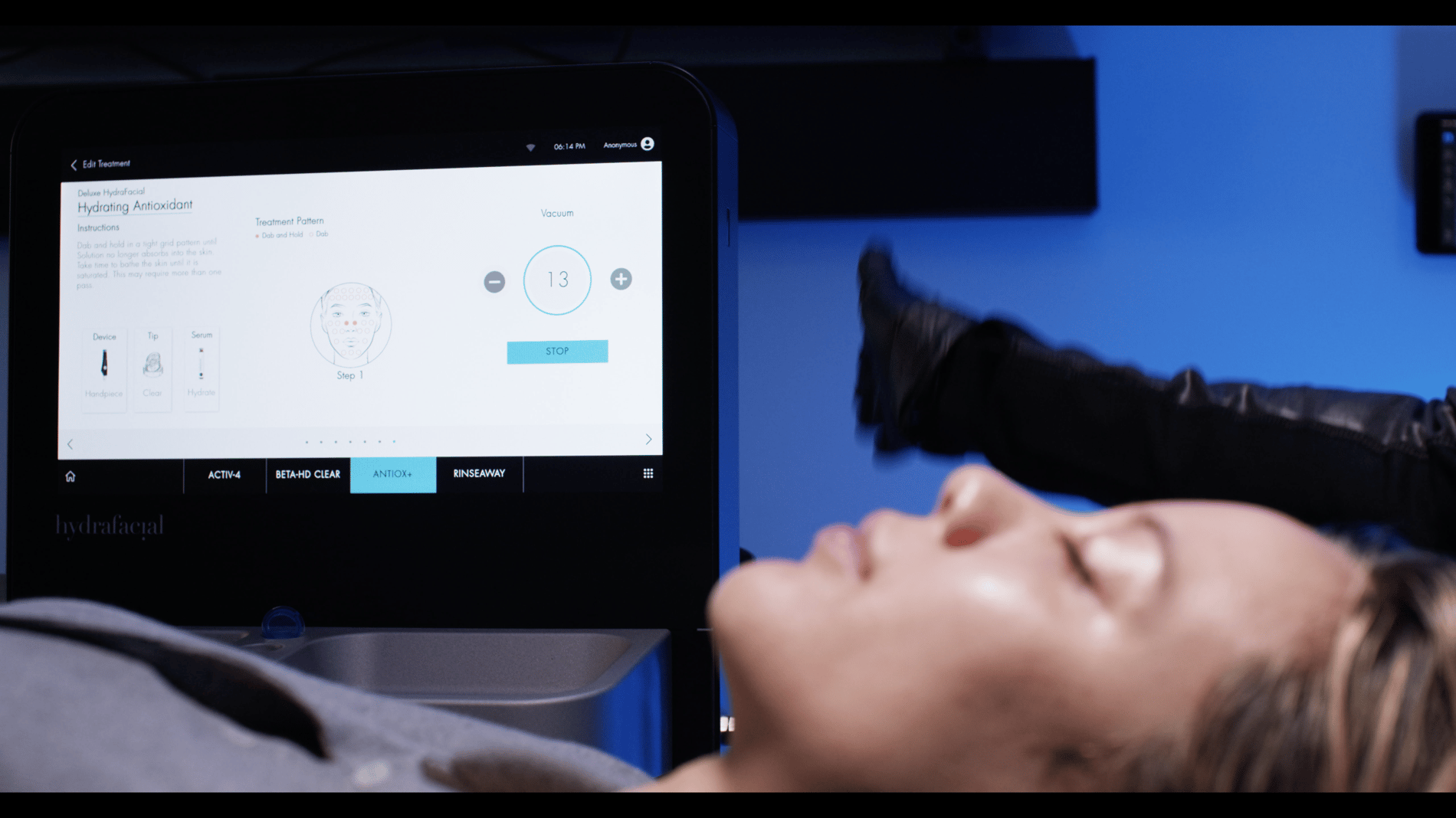 HydraFacial machine with a relaxed woman.