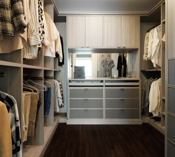 Tan & Gray Walk-in Closet with Organized Clothes and Accessories California Closets Westchester NY Gray and Beige Walk-in Closet Double Hanging Open Storage Center Vanity with Built-in Mirror and Custom Jewelry Drawers