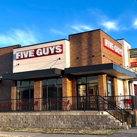Exterior photograph of the Five Guys restaurant at 3702 South Peoria Avenue in Tulsa, Oklahoma.