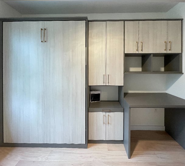 Custom Cabinets Wood Finish | California Closets Southern New Jersey Custom cabinets storage solution in wood grain finish created by California Closets Southern New Jersey