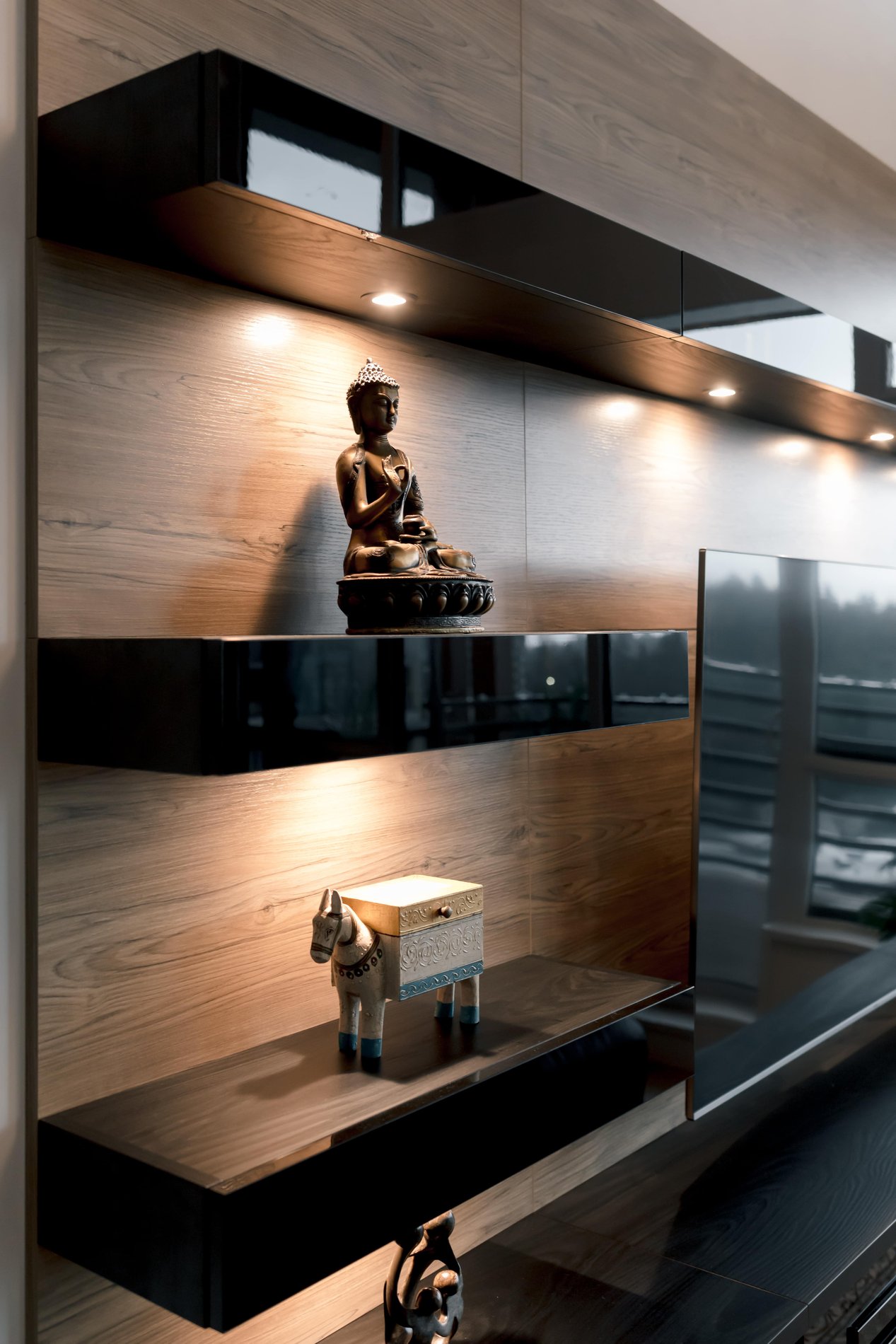 Floating black acrylic shelving Angle view of floating display shelves with built in lighting