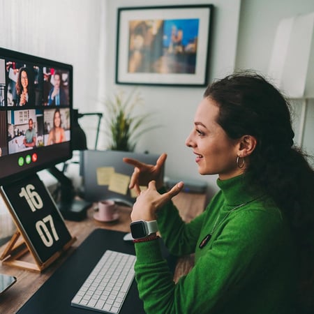 Woman talking to four people in an online call