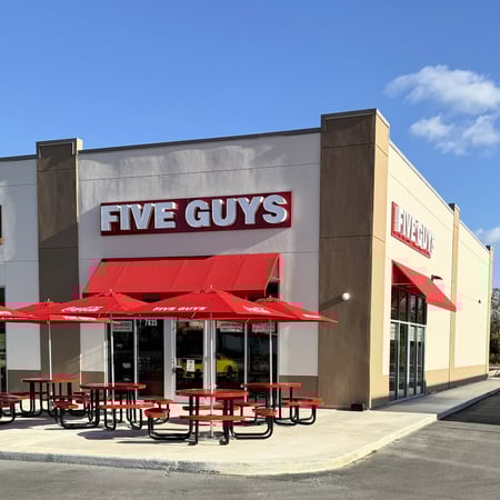 Exterior photograph of the Five Guys restaurant at 7635 Florida 64 in Bradenton, Florida.