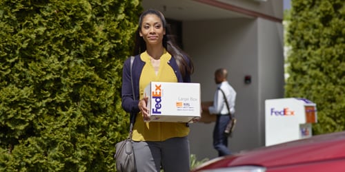 Woman picking up a package from a retail location