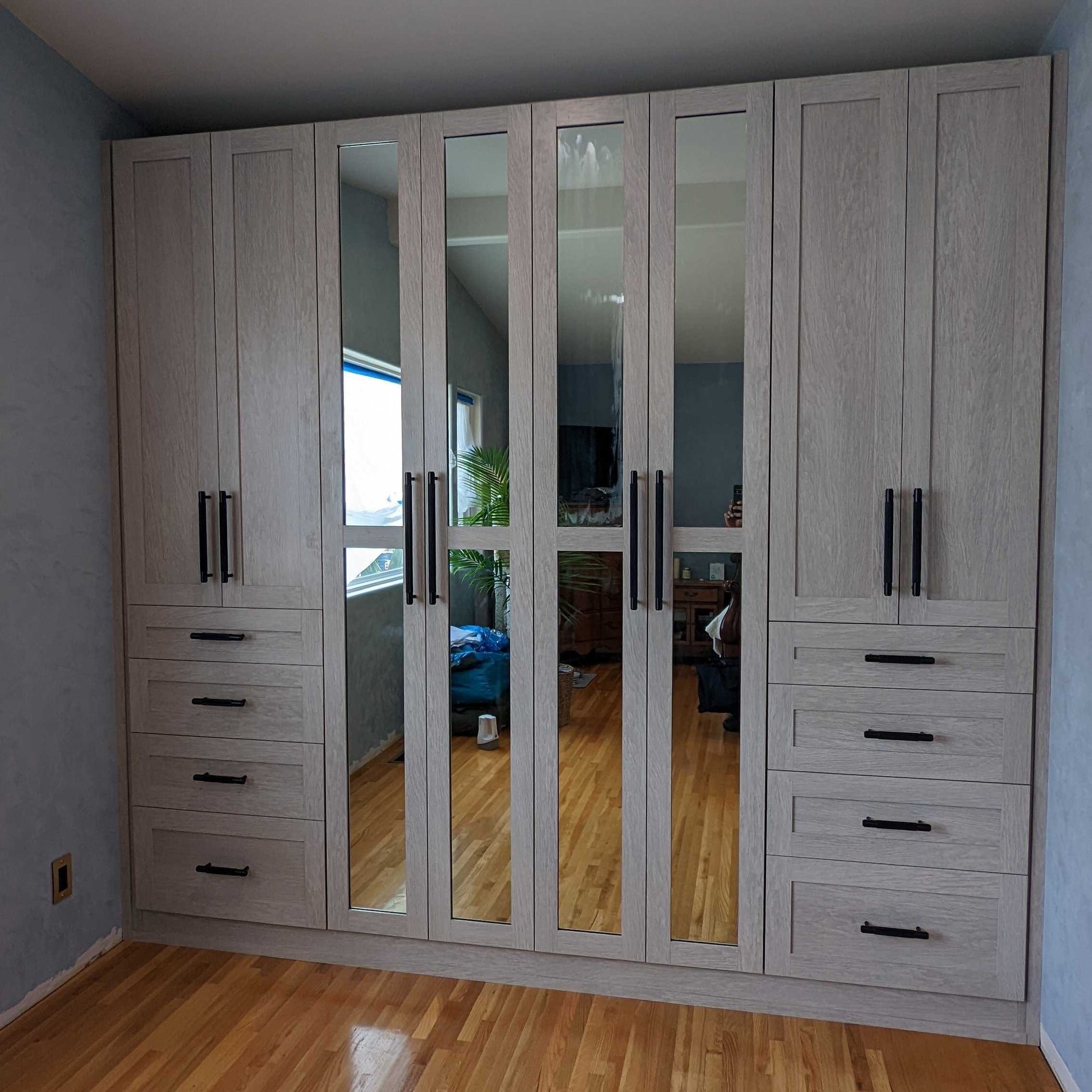 Grey Wardrobe with Mirrored Doors Grey reach-in closet with drawers and cabinets