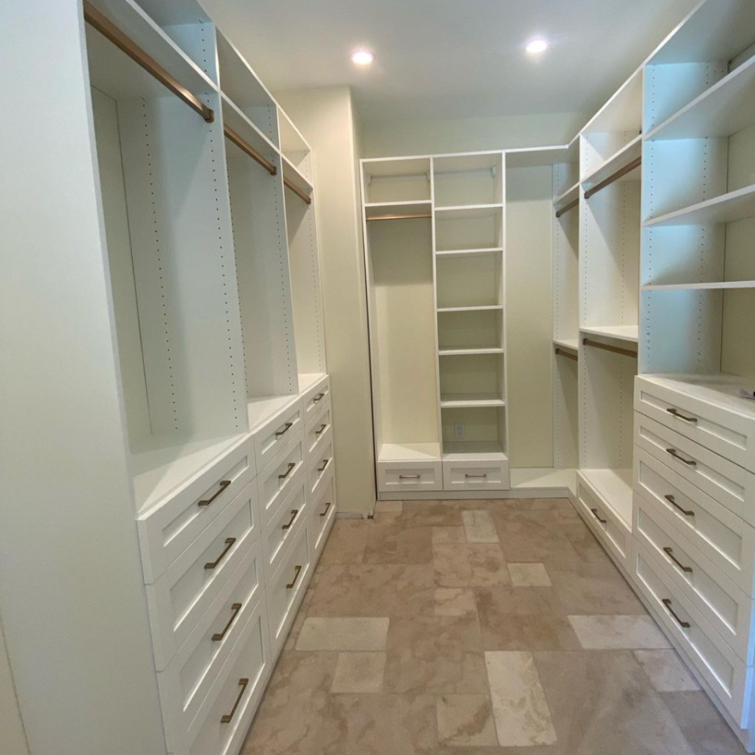 Luxe white walk-in closet Luxe white walk-in closet with gold finishes
