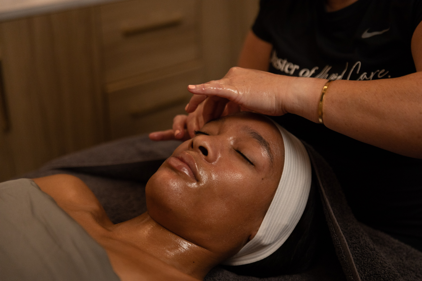 woman receiving relaxing facial treatment